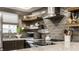 Modern kitchen with stainless steel appliances and gray tile backsplash at 634 E Vermont St, Indianapolis, IN 46202