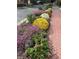 Landscaped garden with colorful mums and brick walkway at 634 E Vermont St, Indianapolis, IN 46202