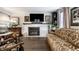 Elegant living room with fireplace, hardwood floors, and ornate furniture at 634 E Vermont St, Indianapolis, IN 46202