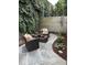 Private patio with seating area and mature ivy at 634 E Vermont St, Indianapolis, IN 46202
