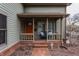 Inviting front porch features a cozy seating area and a welcoming entrance, perfect for relaxing outdoors at 634 E Vermont St, Indianapolis, IN 46202