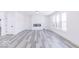 Spacious basement with gray vinyl flooring and a modern fireplace at 6752 W Buck Stone Dr, McCordsville, IN 46055