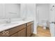 Bright bathroom with a double vanity, a large mirror, and a shower at 6752 W Buck Stone Dr, McCordsville, IN 46055