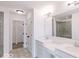 Bright bathroom featuring double sinks and a walk-in shower at 6752 W Buck Stone Dr, McCordsville, IN 46055