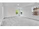 Bedroom features neutral carpet, and natural light from the large window at 6752 W Buck Stone Dr, McCordsville, IN 46055