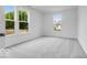 Bedroom with large windows providing lots of natural light and grey carpet at 6752 W Buck Stone Dr, McCordsville, IN 46055