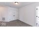 Spacious bedroom with double doors and gray carpet at 6752 W Buck Stone Dr, McCordsville, IN 46055