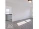 Bright bedroom with gray carpeting and two large windows at 6752 W Buck Stone Dr, McCordsville, IN 46055