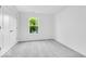 Well-lit bedroom with neutral carpet and a view from the window at 6752 W Buck Stone Dr, McCordsville, IN 46055