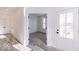 Light and airy entryway with gray vinyl flooring and access to an office at 6752 W Buck Stone Dr, McCordsville, IN 46055