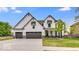 Striking two-story home featuring a three-car garage and a modern farmhouse design at 6752 W Buck Stone Dr, McCordsville, IN 46055