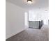 Upstairs hallway with gray carpet and railing overlooking the floor below at 6752 W Buck Stone Dr, McCordsville, IN 46055