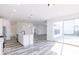 Open concept kitchen with island and access to sunroom and living areas at 6752 W Buck Stone Dr, McCordsville, IN 46055