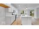 Beautiful white kitchen boasts a spacious island and stainless steel appliances at 6752 W Buck Stone Dr, McCordsville, IN 46055