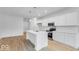 Kitchen with an island, stainless steel appliances, white countertops, and pendant lighting at 6752 W Buck Stone Dr, McCordsville, IN 46055