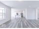 Open living room featuring hardwood floors and kitchen views at 6752 W Buck Stone Dr, McCordsville, IN 46055