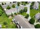 Aerial view of townhomes featuring well-maintained landscaping, mature trees, and manicured lawns at 7042 Tyler Ln, Indianapolis, IN 46217