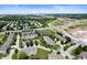 Beautiful aerial view of a townhome community with multiple ponds, mature trees, and well-maintained landscaping at 7042 Tyler Ln, Indianapolis, IN 46217
