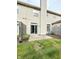 Back exterior with sliding glass doors that open to a concrete patio and well maintained siding at 7042 Tyler Ln, Indianapolis, IN 46217