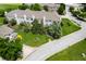 This townhome features a private patio, well-maintained landscaping, and mature trees at 7042 Tyler Ln, Indianapolis, IN 46217