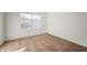 Bright bedroom with neutral carpeting and large window at 7042 Tyler Ln, Indianapolis, IN 46217