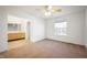 Spacious bedroom with neutral carpeting and large window at 7042 Tyler Ln, Indianapolis, IN 46217