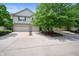 Inviting townhome community featuring attached garages, well-maintained driveways, and mature trees at 7042 Tyler Ln, Indianapolis, IN 46217