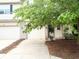 Attractive townhouse featuring an attached garage, well-maintained landscaping, and a welcoming entrance at 7042 Tyler Ln, Indianapolis, IN 46217