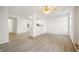Open living room, kitchen, and dining area with light flooring at 7042 Tyler Ln, Indianapolis, IN 46217