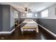 Spacious bedroom with dark hardwood floors and ceiling fan at 7816 Delbrook Dr, Indianapolis, IN 46260