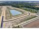 Aerial view of new homes and pond in a residential development at 7824 Magnolia St, New Palestine, IN 46163