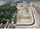 Aerial view of new construction homes and pond at 7824 Magnolia St, New Palestine, IN 46163