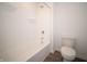 Bathroom featuring clean, white tub and shower and toilet for a refreshing experience at 7824 Magnolia St, New Palestine, IN 46163