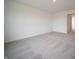 A well-lit bedroom with neutral carpet and fresh, white walls offers an inviting atmosphere for relaxation and comfort at 7824 Magnolia St, New Palestine, IN 46163