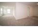 The bedroom provides cozy carpet, and a double window and doors into the hallway and other rooms offer plenty of living space at 7824 Magnolia St, New Palestine, IN 46163