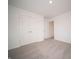 Bright bedroom offering closet space, neutral walls, and plush carpeting, ready for personalization at 7824 Magnolia St, New Palestine, IN 46163