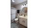 Updated bathroom with white vanity, gray flooring, and stylish decor at 7887 Elk Dr, Nineveh, IN 46164