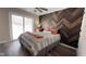 Bedroom with herringbone feature wall and sliding glass door at 7887 Elk Dr, Nineveh, IN 46164