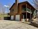Stunning multi-level cabin featuring a large deck, two-car garage, and gorgeous natural wood siding at 7887 Elk Dr, Nineveh, IN 46164