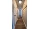 Long hallway with light walls and wood-look flooring at 7887 Elk Dr, Nineveh, IN 46164