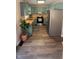 Kitchen with teal cabinets and wood-look floors at 7887 Elk Dr, Nineveh, IN 46164