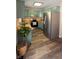 Kitchen with teal cabinets and wood-look floors at 7887 Elk Dr, Nineveh, IN 46164