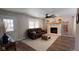 Living room with stone fireplace and large windows at 7887 Elk Dr, Nineveh, IN 46164