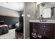 Basement bathroom with vanity and dark brown cabinets at 7928 Stonebriar Way, Indianapolis, IN 46259