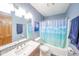 Simple bathroom with tub shower, toilet and vanity at 8022 Talliho Dr, Indianapolis, IN 46256