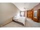 Spacious bedroom with vaulted ceiling, built-in shelves, and a ceiling fan at 8022 Talliho Dr, Indianapolis, IN 46256