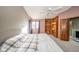 Large bedroom with vaulted ceiling, built-in shelves, and a ceiling fan at 8022 Talliho Dr, Indianapolis, IN 46256