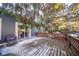 Wooden deck with a wooden railing, partially covered in snow at 8022 Talliho Dr, Indianapolis, IN 46256