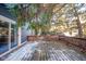 Wooden deck with a wooden railing, partially covered in snow at 8022 Talliho Dr, Indianapolis, IN 46256