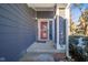 Front entrance with red door and gray siding at 8022 Talliho Dr, Indianapolis, IN 46256